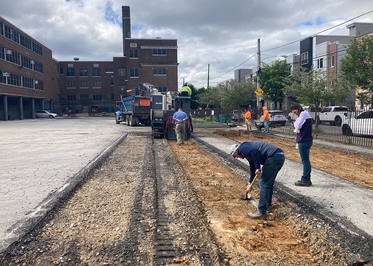 A machine tears up asphalt 