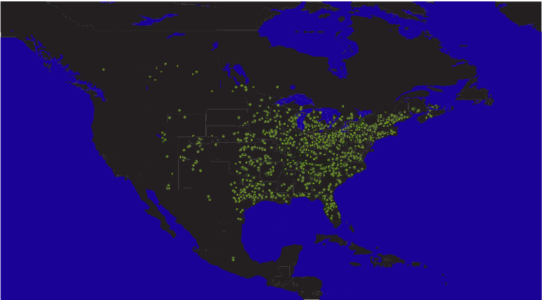 This dark map, with black continents and dark blue water, shows yellow-green pinpricks of light in clusters throughout North America.